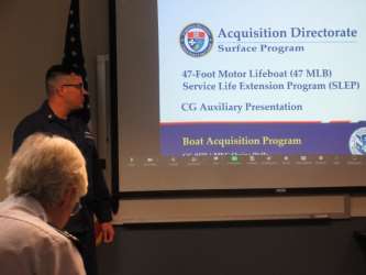 Bellingham, Wash – MKC Wells discusses the 47’ MLB SLEP program to the Auxiliary. US Coast Guard photo by Peter Border.