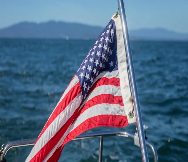 Bellingham Bay, Wash. — The national ensign flies from a Flotilla 11 patrol boat. U.S. Coast Guard Auxiliary photo.