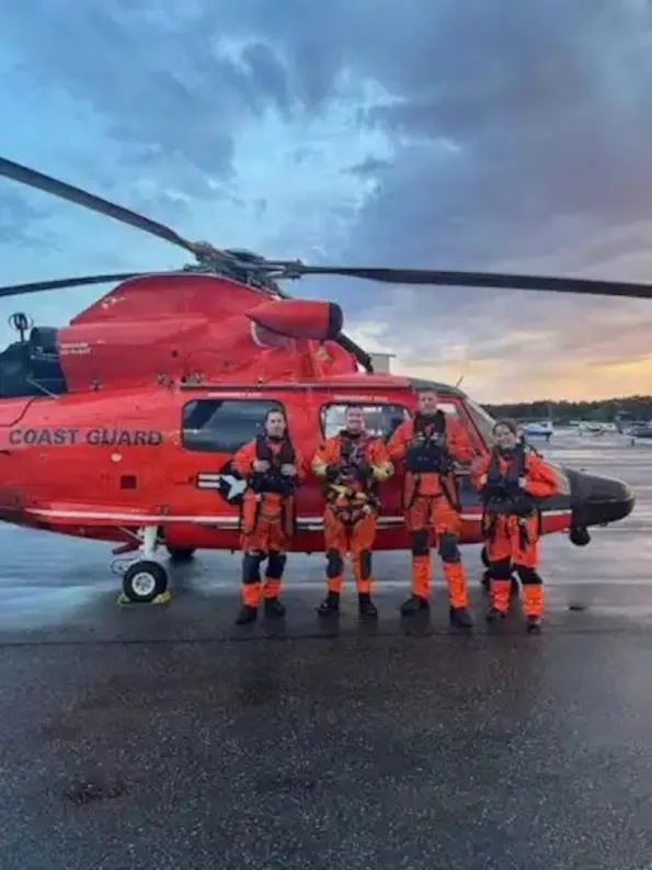 Port Angeles, Wash. — An MH-65 Dolphin aircrew from Air Station Port Angeles stands for a photo after the Sucia Island search-and-rescue case, July 23, 2026. U.S. Coast Guard photo.